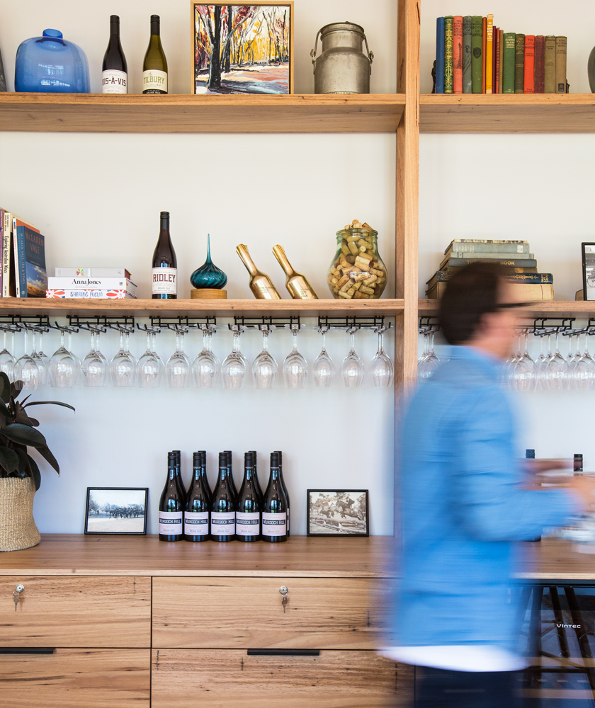 A bookshelf full of wine and books at the Murdoch Hill tasting room.